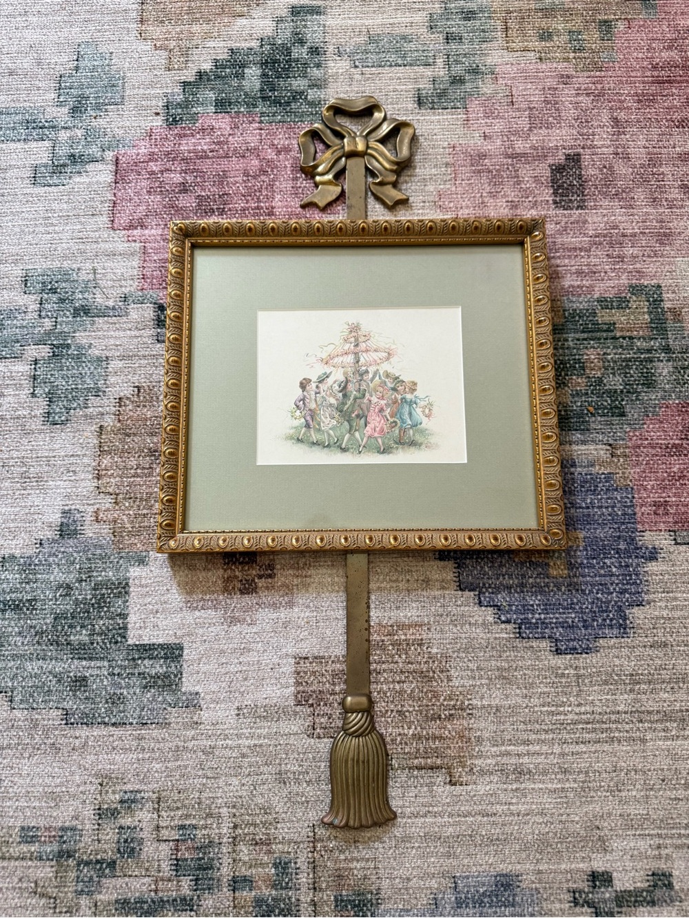 Vintage painting and brass bow hanger